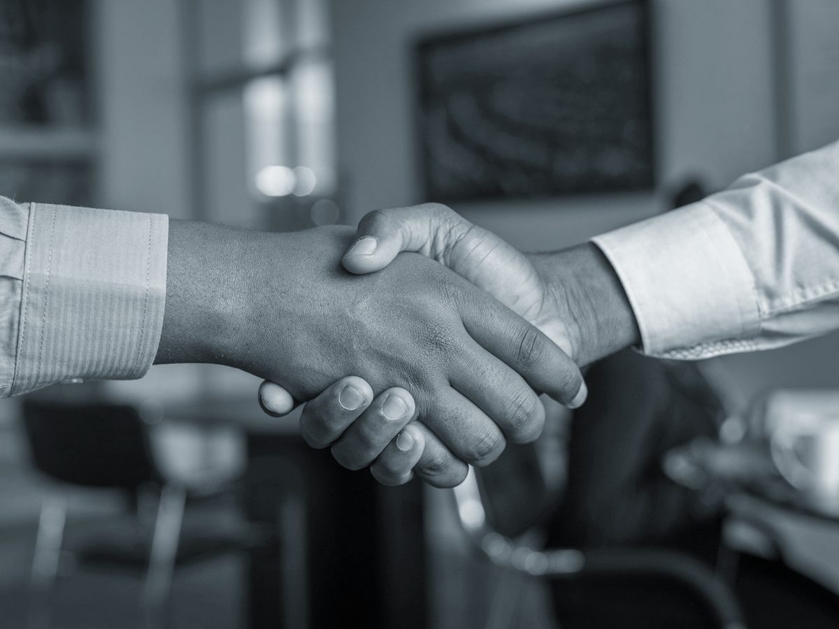 Leaders shaking hands at a meeting