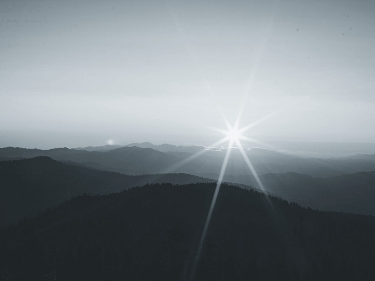 Mountains silhouetted at sunset — a quiet horizon